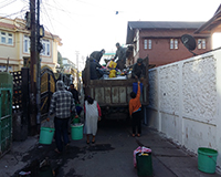 Collecting of house hold waste at residential area in the city